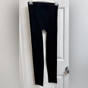 Free People Movement Black Leggings has small cutout holes down back & bottom